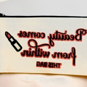 Cream Makeup Bag with Red Text